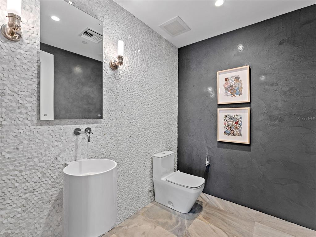 465 Central Avenue, Unit 301 St. Petersburg, FL 33701 - Photo 10 of 47 a bathroom with a toilet sink and mirror