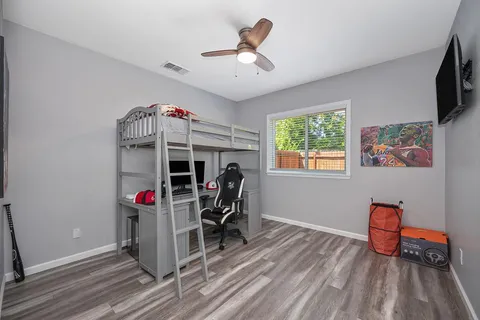 a view of a livingroom with furniture and a flat screen tv