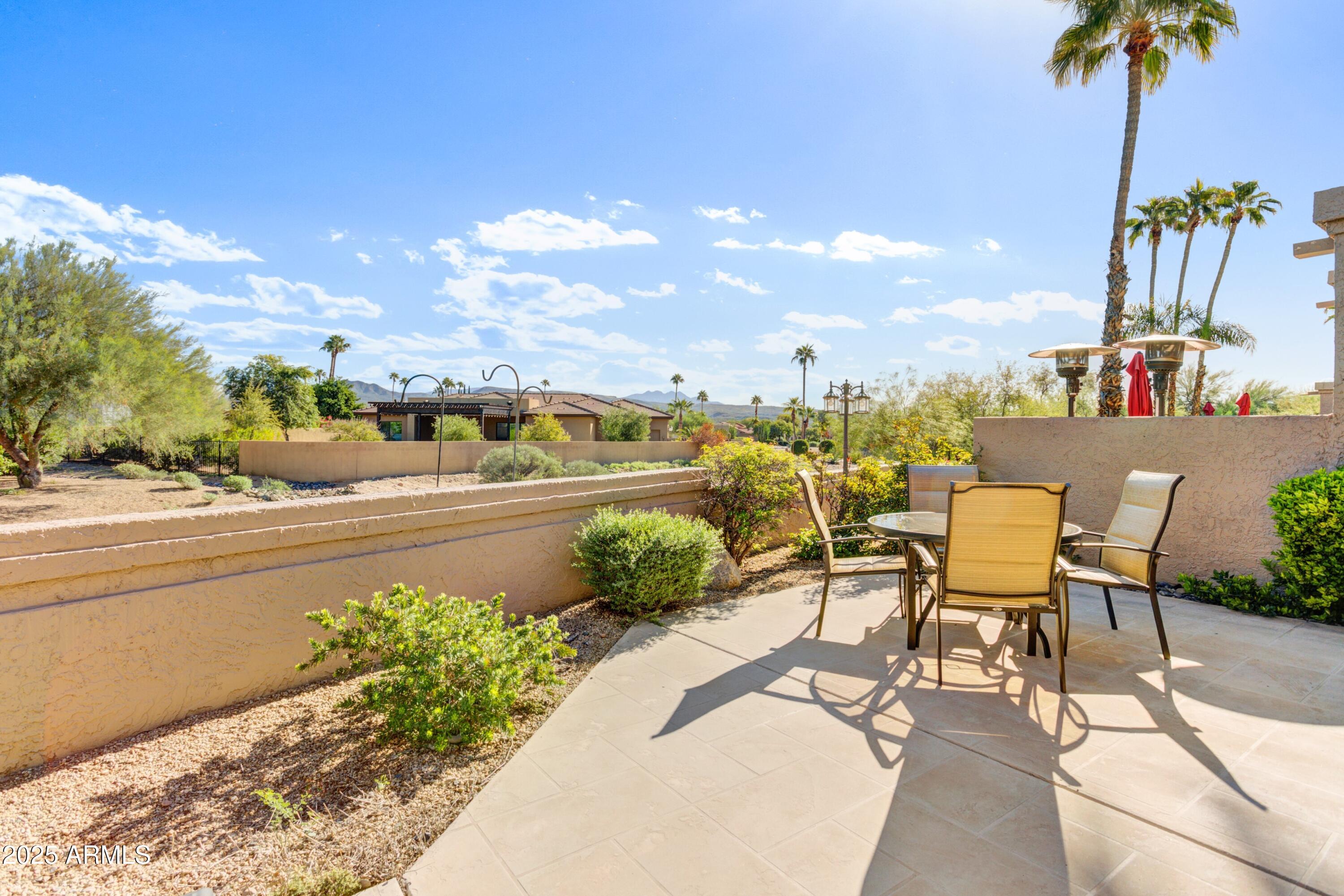25609 Forest Road, Unit 7 Rio Verde, AZ 85263 - Photo 14 of 21 a view of a swimming pool and outdoor seating