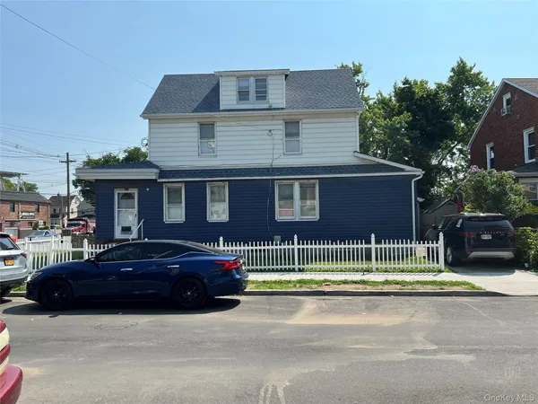 a car parked in front of a house
