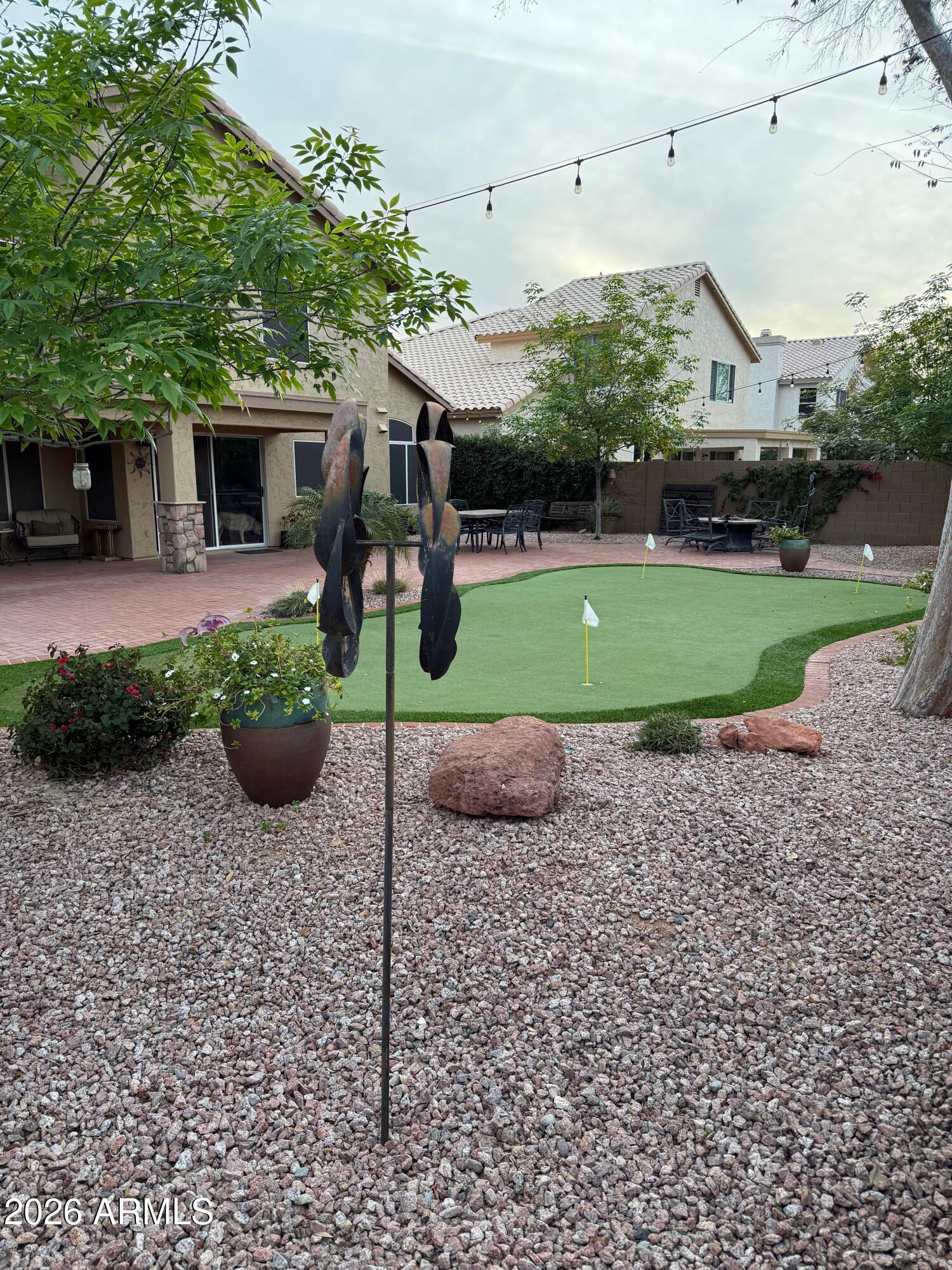 3426 East Clark Road Phoenix, AZ 85050 - Photo 44 of 48 a front view of a house with a garden