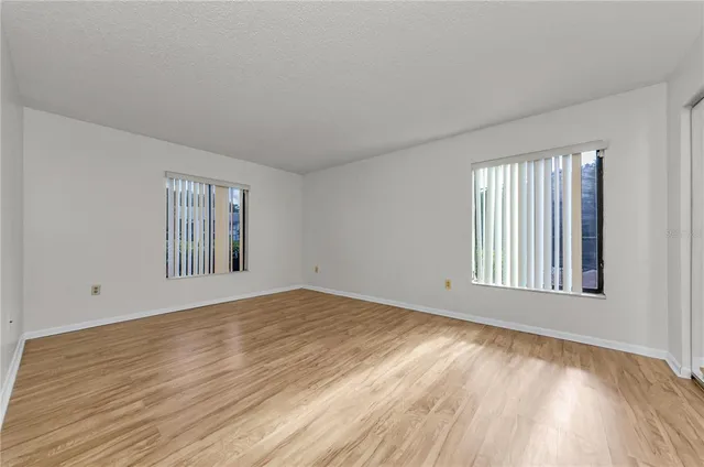 a view of an empty room and glass door
