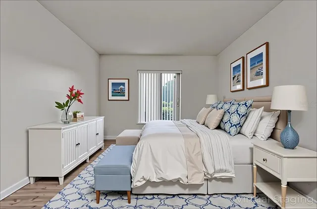 a spacious bedroom with a bed and a window