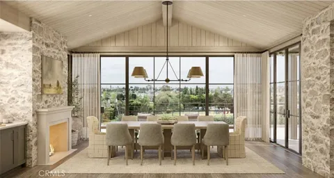 a dining room with furniture a chandelier and a rug