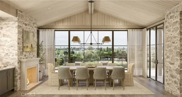 a dining room with furniture a chandelier and a rug
