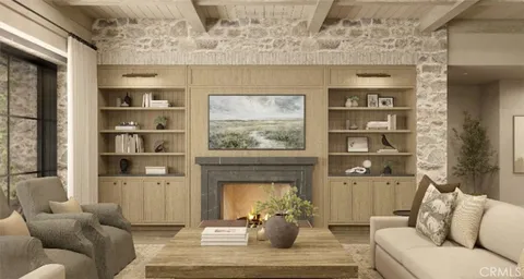 a living room with furniture a window and a fireplace