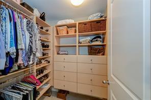3338 Peachtree Road Northeast, Unit 809 Atlanta, GA 30326 - Photo 5 of 23 a view of walk in closet with clothes and shoes