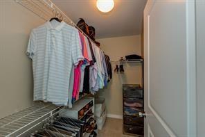 3338 Peachtree Road Northeast, Unit 809 Atlanta, GA 30326 - Photo 10 of 23 a view of walk in closet with clothes and shoes