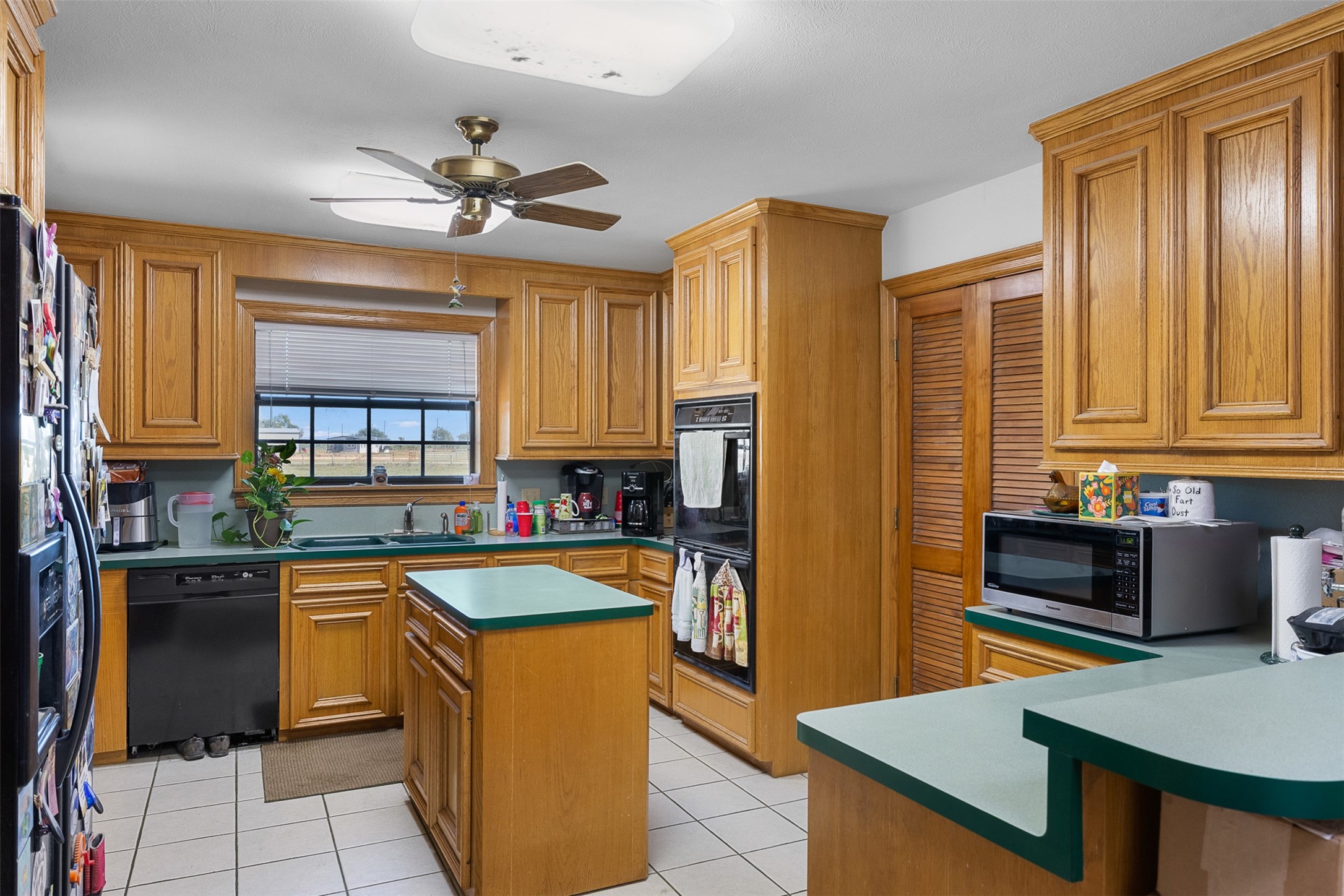 4231 Johnston Road Wallis, TX 77485 - Photo 12 of 43 a kitchen with stainless steel appliances granite countertop a sink stove and refrigerator