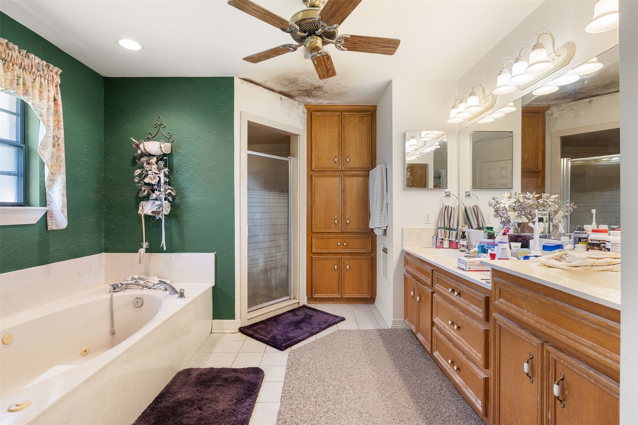 4231 Johnston Road Wallis, TX 77485 - Photo 17 of 43 a bathroom with a tub sink and mirror