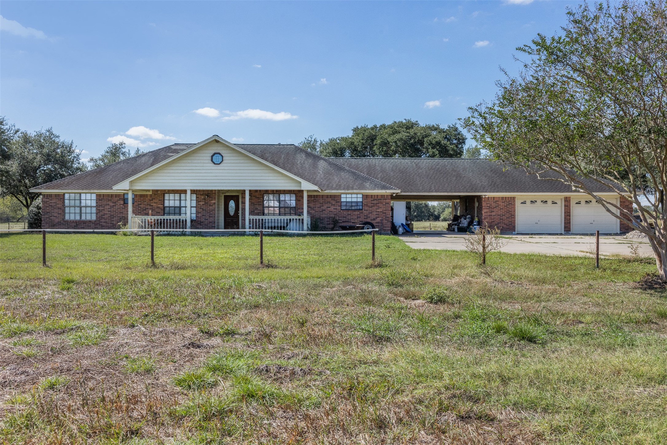 4231 Johnston Road Wallis, TX 77485 - Photo 2 of 43 a view of a house with a yard and sitting area