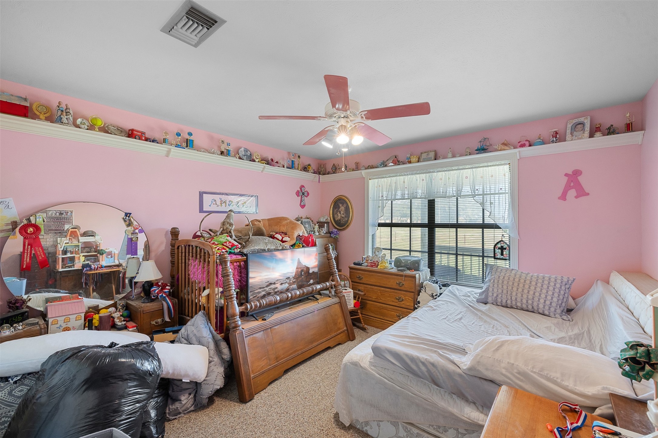 4231 Johnston Road Wallis, TX 77485 - Photo 21 of 43 a bedroom with furniture and a large window