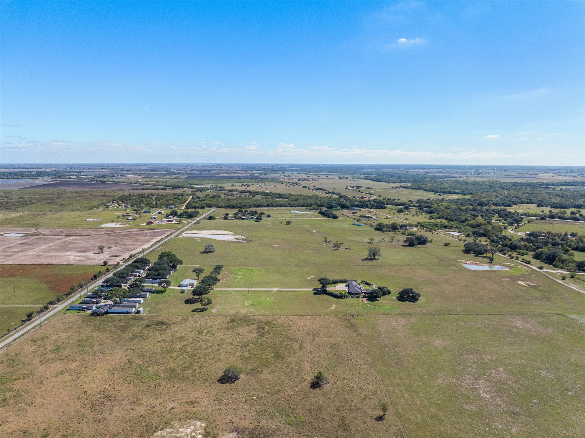 4231 Johnston Road Wallis, TX 77485 - Photo 35 of 43 an aerial view of a city