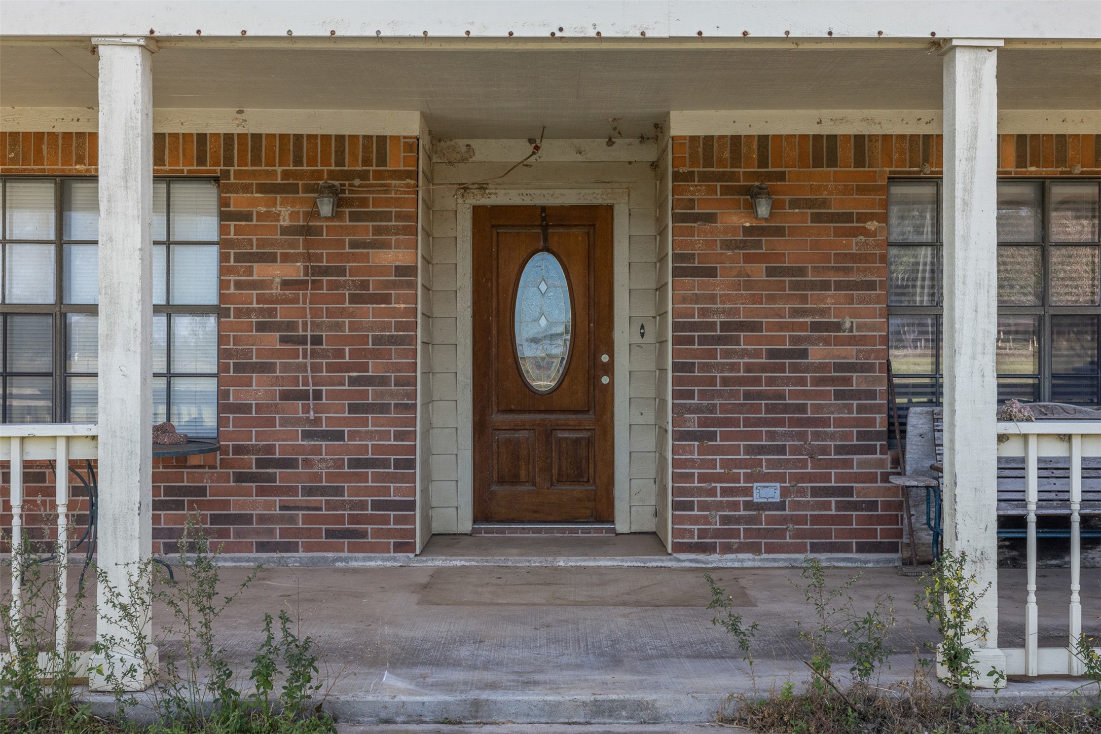 4231 Johnston Road Wallis, TX 77485 - Photo 4 of 43 a front view of a house with a garden