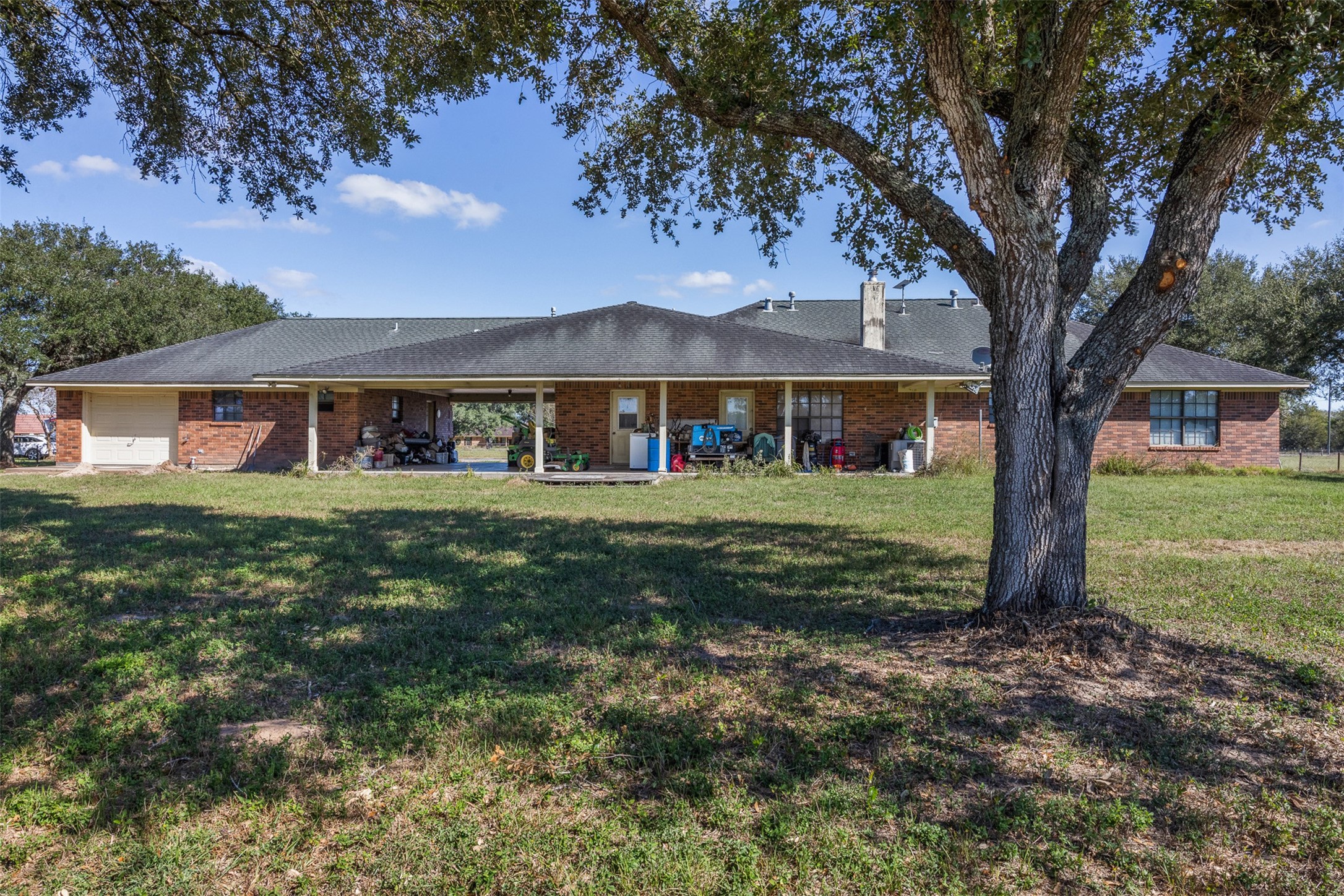 4231 Johnston Road Wallis, TX 77485 - Photo 7 of 43 a front view of a house with garden