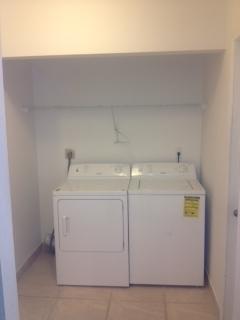 3870 Sabal Lakes Road Delray Beach, FL 33445 - Photo 11 of 17 a utility room with dryer and washer