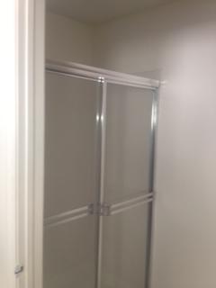 3870 Sabal Lakes Road Delray Beach, FL 33445 - Photo 16 of 17 a bathroom with a glass shower door
