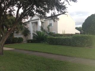 3870 Sabal Lakes Road Delray Beach, FL 33445 - Photo 6 of 17 a view of a house with a yard