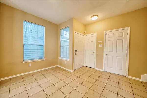 a view of an empty room and window