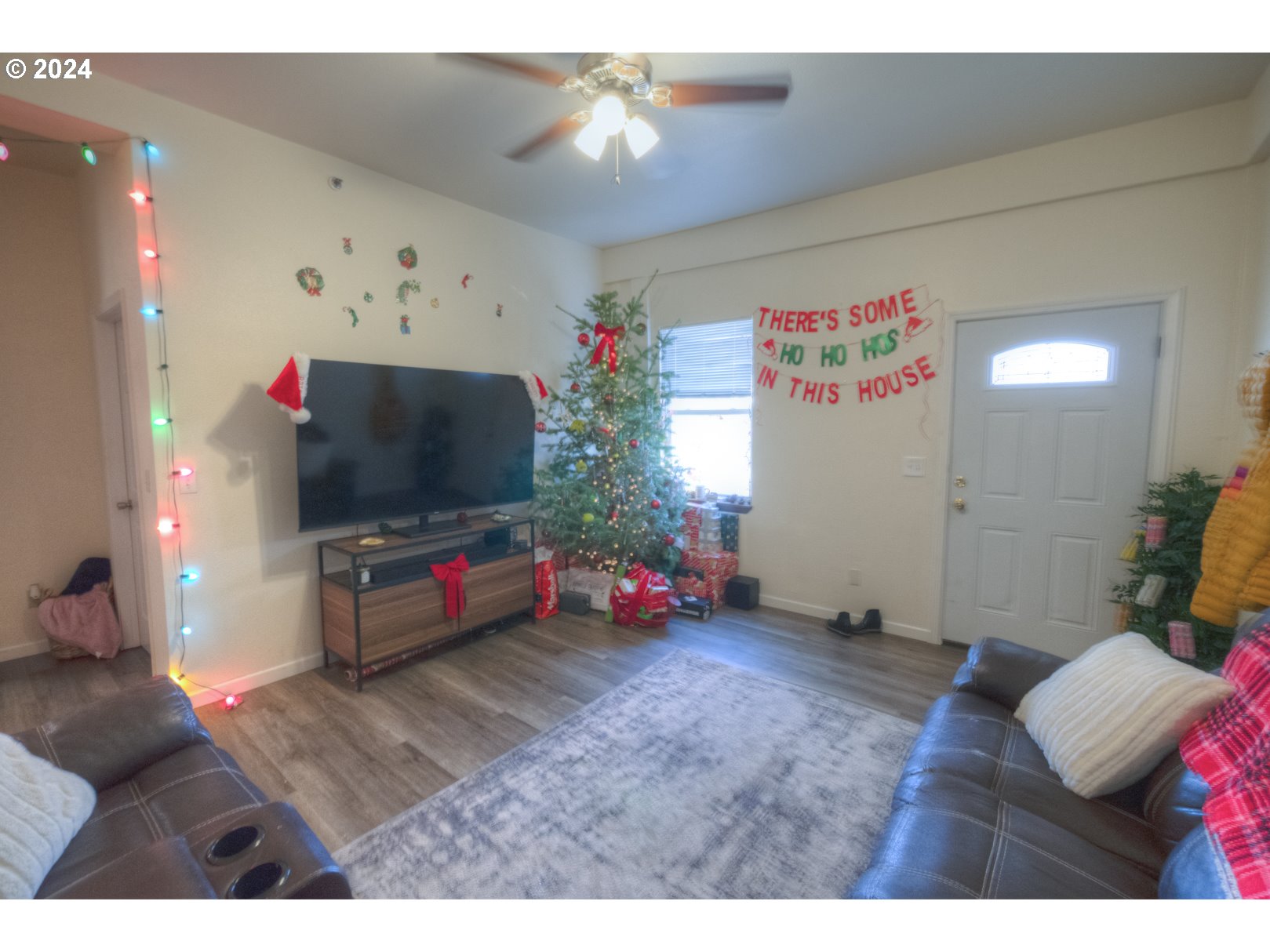 415 Southwest 7th Street Pendleton, OR 97801 - Photo 25 of 40 a living room with furniture and a flat screen tv