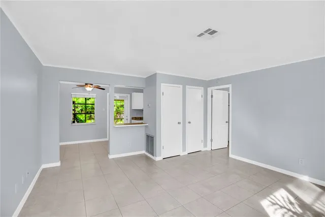 a view of an empty room with a window