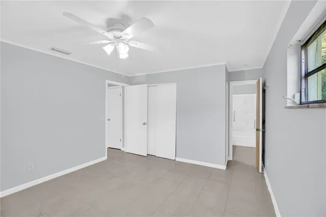 a view of an empty room with a window