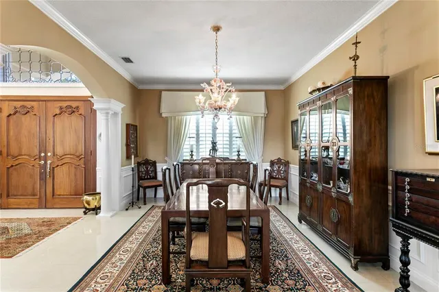 a kitchen with granite countertop a sink and a refrigerator