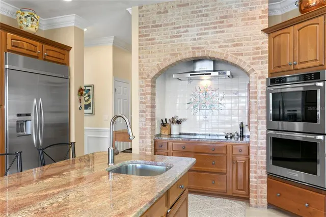 a view of a hallway with furniture and window