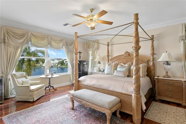 a bedroom with a bed a window and a dresser