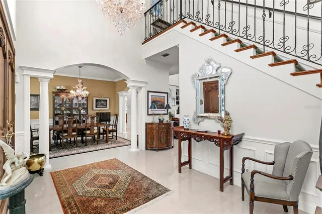 a living room with furniture fireplace and a large window