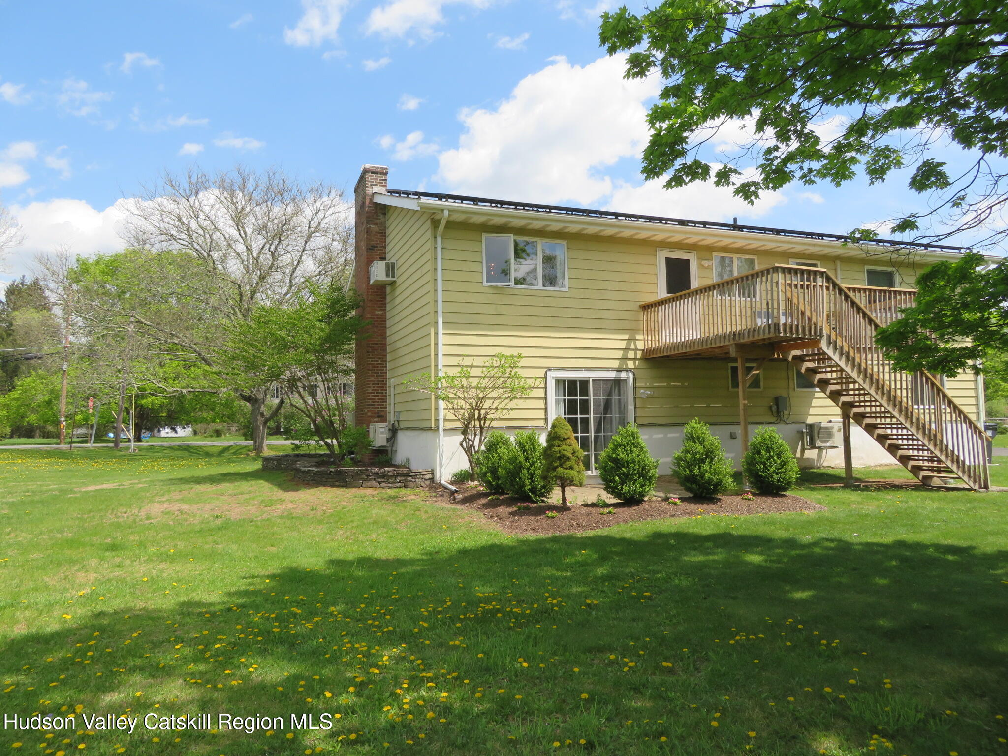 3597 Atwood Road Stone Ridge, NY 12484 - Photo 54 of 56 a front view of a house with a yard and garage