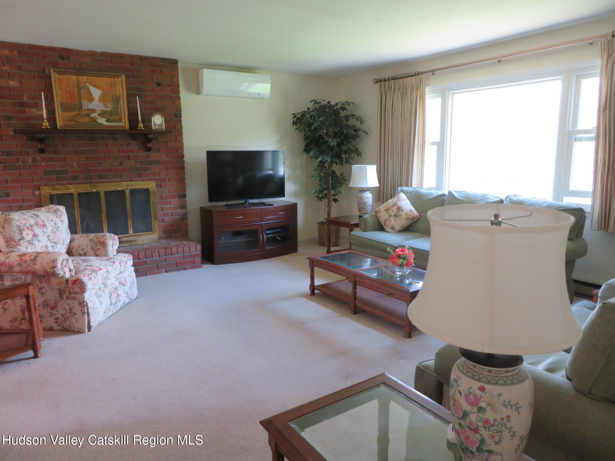 3597 Atwood Road Stone Ridge, NY 12484 - Photo 7 of 56 a living room with furniture and a flat screen tv