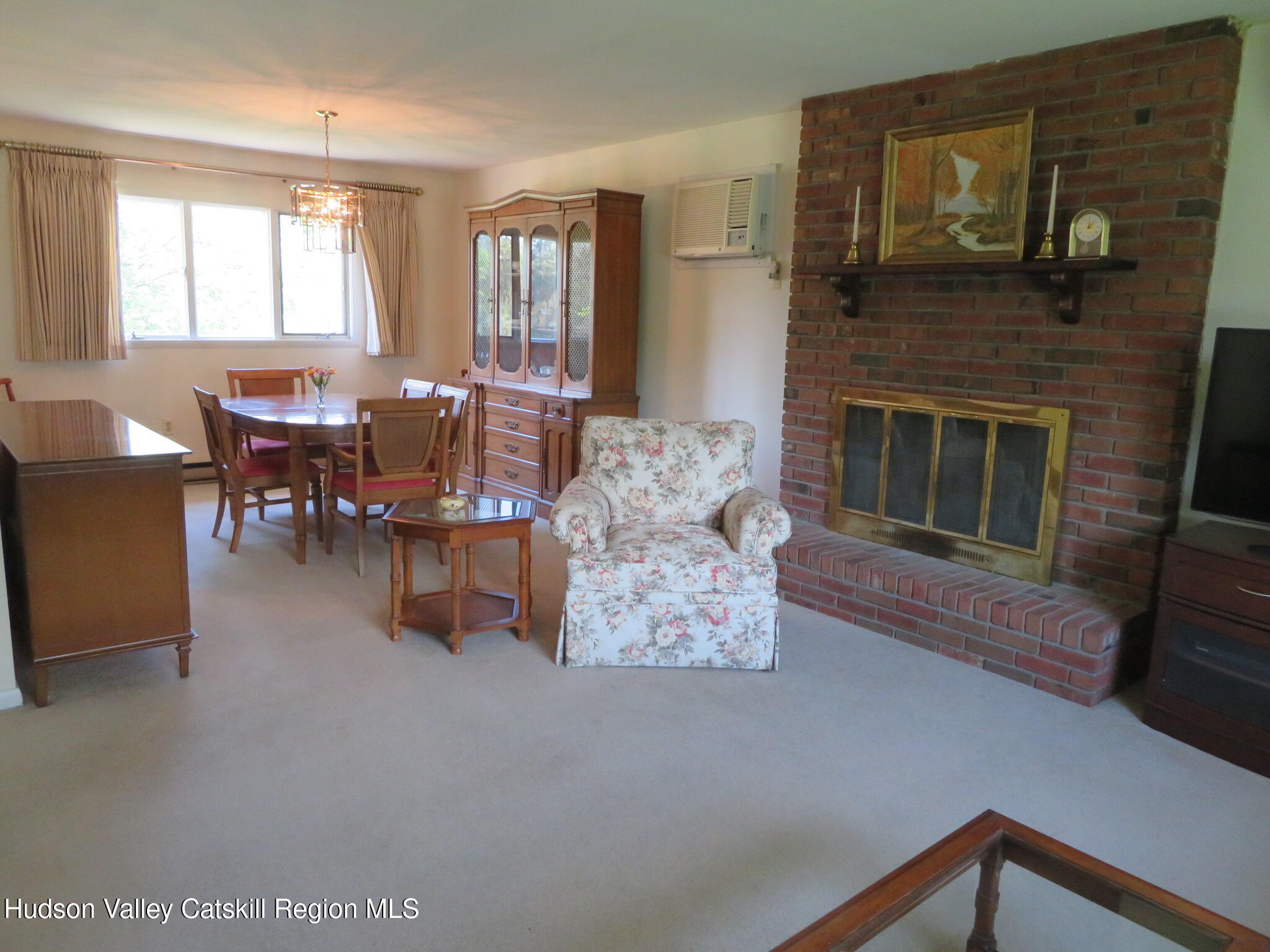 3597 Atwood Road Stone Ridge, NY 12484 - Photo 9 of 56 a living room with furniture a large window and a fireplace