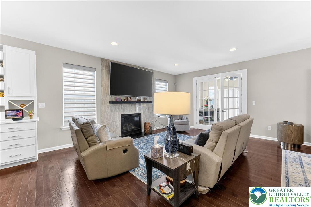 3465 Treeview Drive Emmaus, PA 18049 - Photo 12 of 38 a living room with furniture fireplace and a flat screen tv