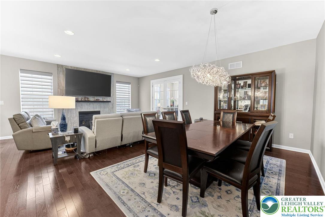 3465 Treeview Drive Emmaus, PA 18049 - Photo 13 of 38 a view of a dining room with furniture and wooden floor