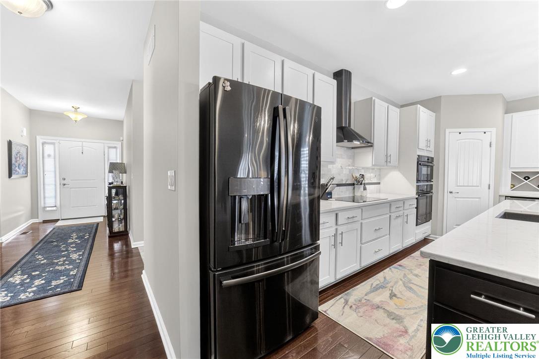 3465 Treeview Drive Emmaus, PA 18049 - Photo 16 of 38 a kitchen with stainless steel appliances a refrigerator and a stove top oven