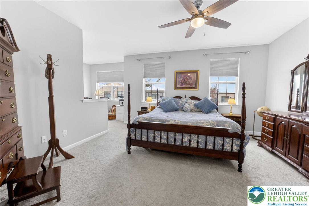 3465 Treeview Drive Emmaus, PA 18049 - Photo 20 of 38 a bedroom with a bed a couch and dresser