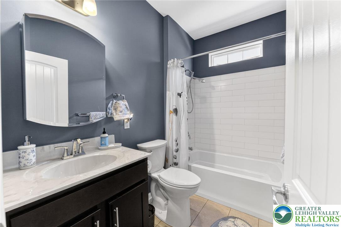 3465 Treeview Drive Emmaus, PA 18049 - Photo 27 of 38 a bathroom with a granite countertop sink toilet and shower