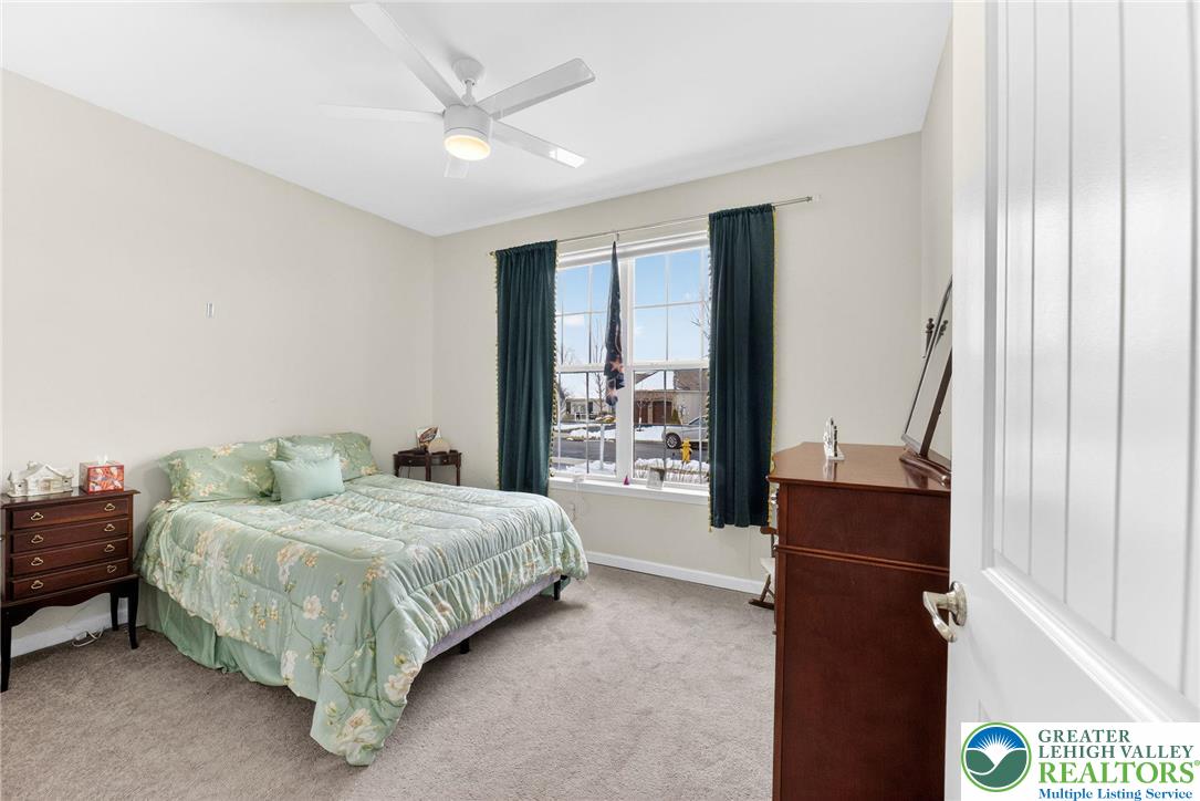 3465 Treeview Drive Emmaus, PA 18049 - Photo 28 of 38 a bedroom with a bed table and a window
