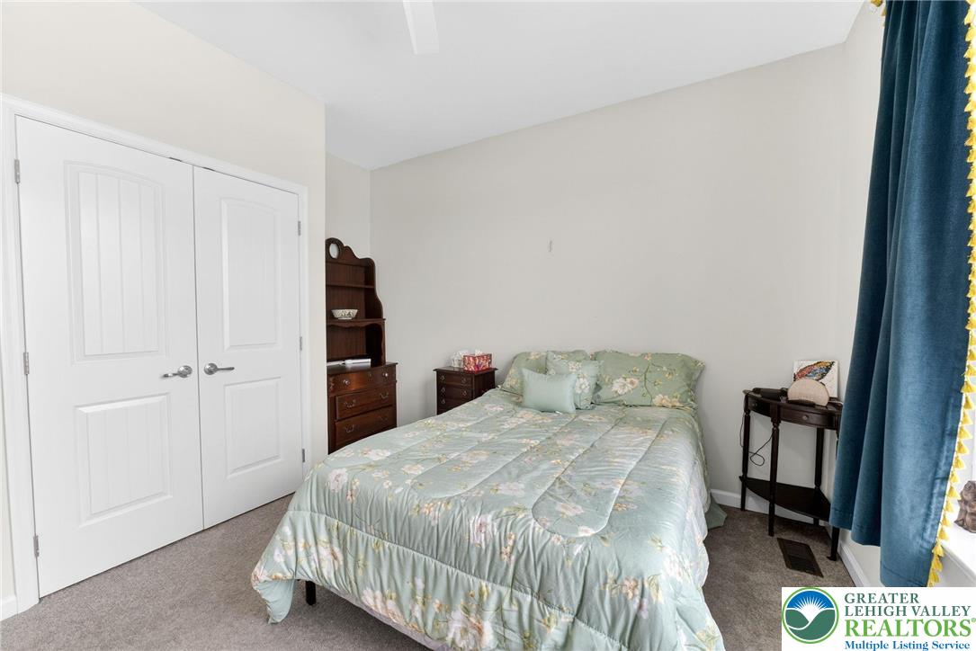 3465 Treeview Drive Emmaus, PA 18049 - Photo 29 of 38 a bedroom with a bed and a book shelf