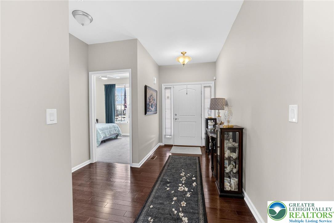 3465 Treeview Drive Emmaus, PA 18049 - Photo 3 of 38 a living room with furniture and a walk in closet with wooden floor