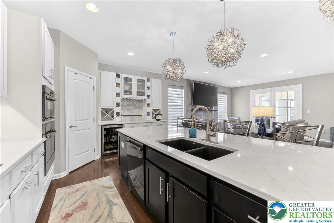 3465 Treeview Drive Emmaus, PA 18049 - Photo 9 of 38 a kitchen with stainless steel appliances a sink a stove and refrigerator
