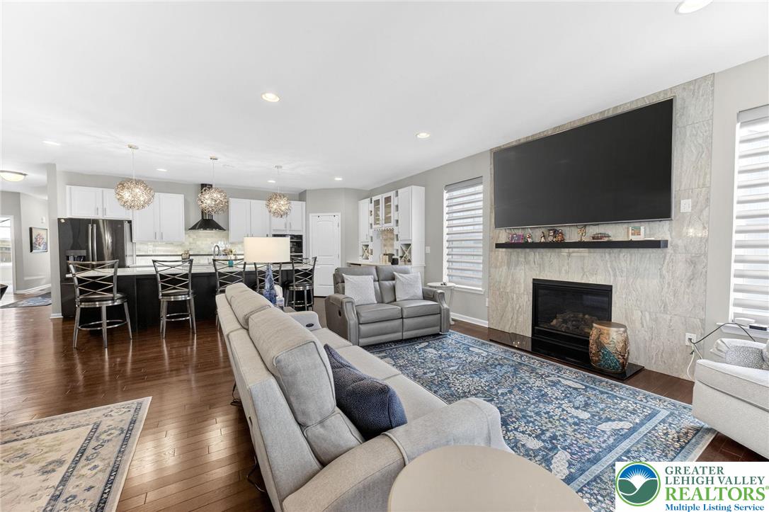 3465 Treeview Drive Emmaus, PA 18049 - Photo 10 of 38 a living room with furniture fireplace and flat screen tv