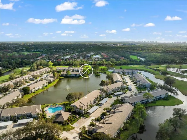 an aerial view of city and lake