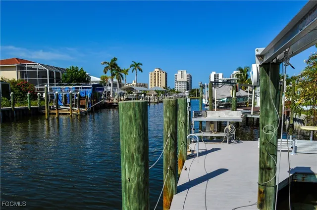 a view of a balcony with two couches chairs and wooden floor