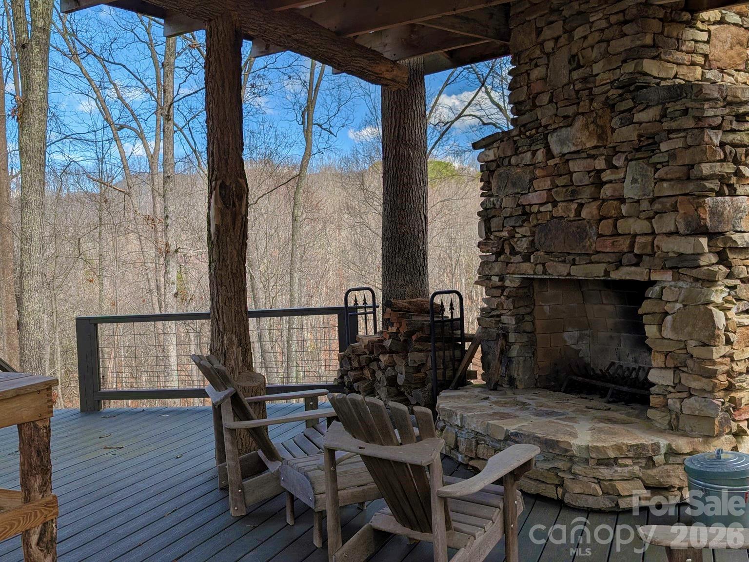 51 Wild Turkey Loop, Unit 32 Marshall, NC 28753 - Photo 19 of 37 a patio with table and chairs and potted plants