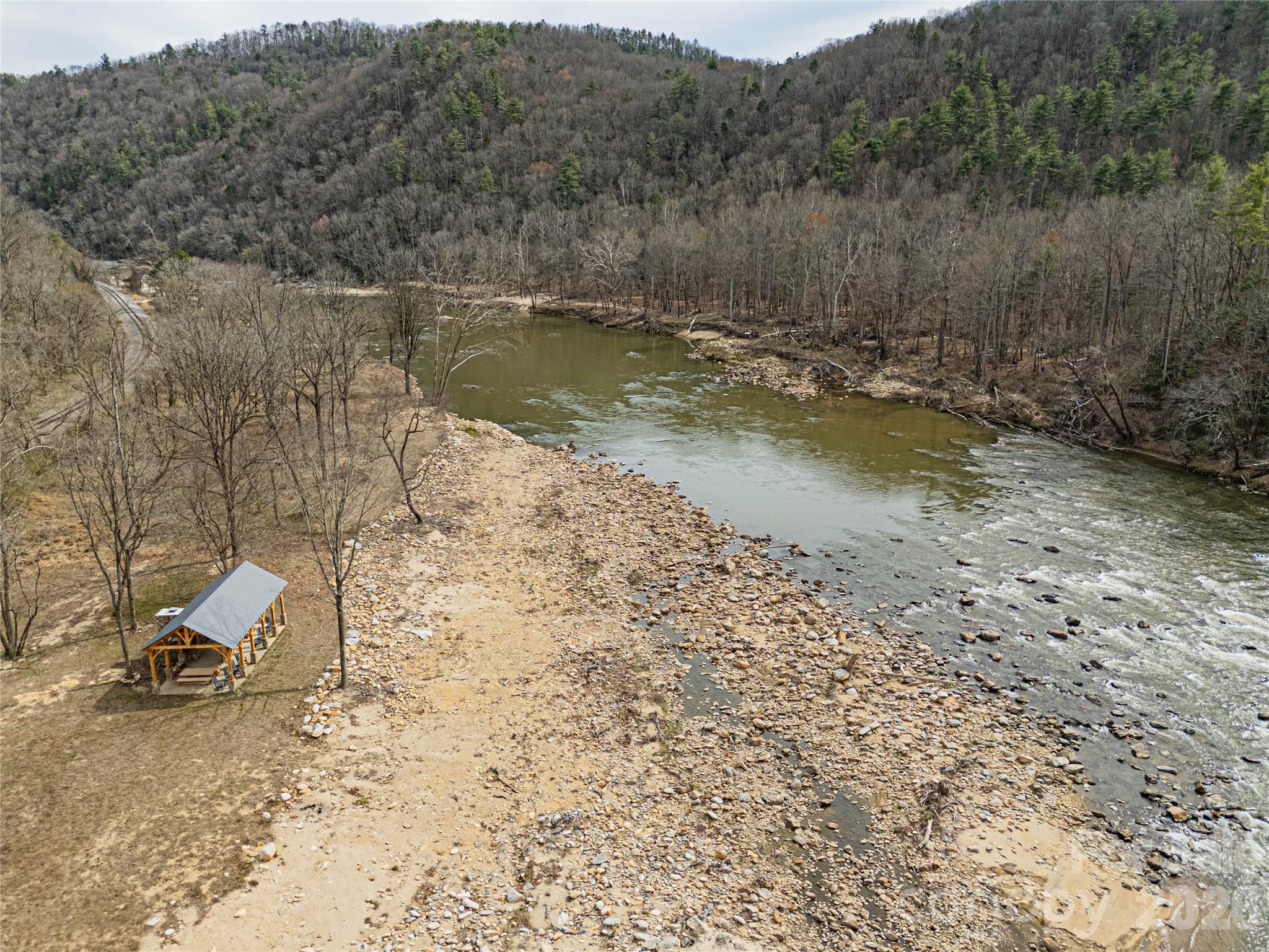 51 Wild Turkey Loop, Unit 32 Marshall, NC 28753 - Photo 21 of 37 a view of a lake with a mountain view