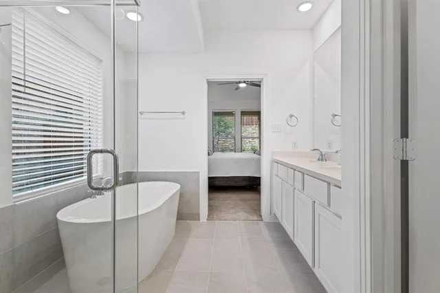 a bathroom with a bathtub and a sink