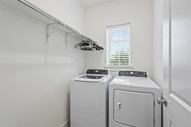 a utility room with dryer and washer