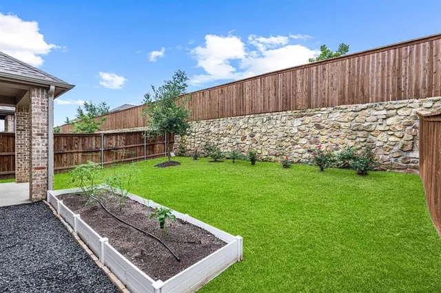 a view of a backyard with a garden